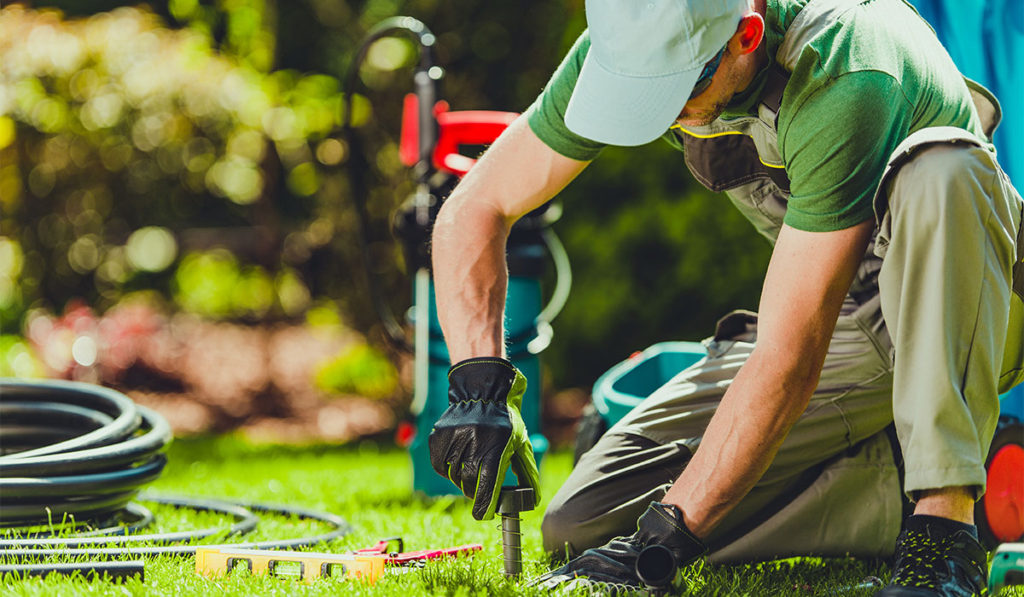 contractor installing a sprinkler system