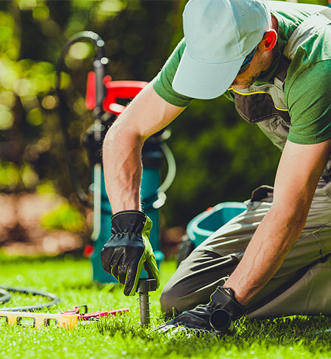 contractor installing a sprinkler system